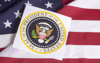 Presidential seal over U.S. flag