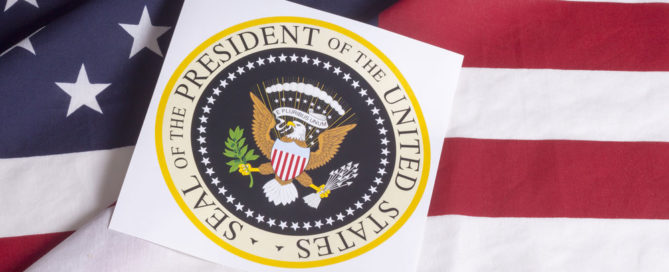 Presidential seal over U.S. flag