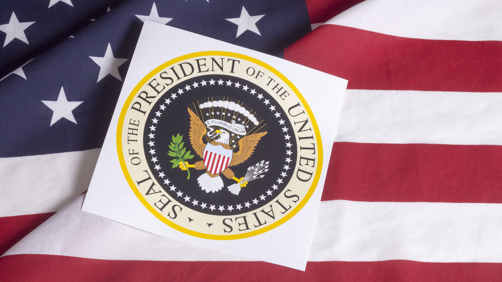 Presidential seal over U.S. flag