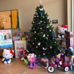 Toys for Tots 2017 Christmas tree in lobby surrounded by donations