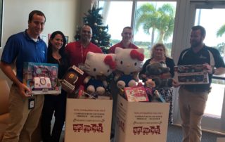 BRAA Staff with donated toys in Toys for Tots 2017