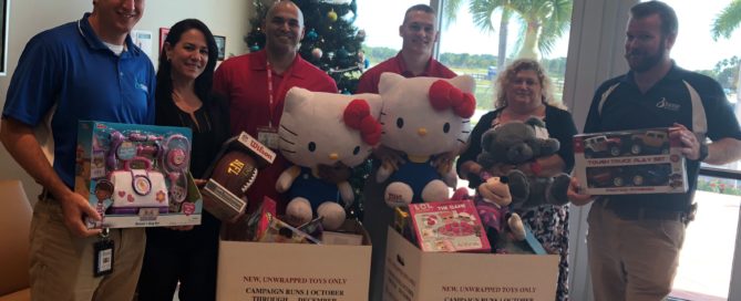 BRAA Staff with donated toys in Toys for Tots 2017