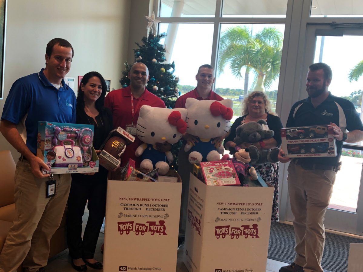 BRAA Staff with donated toys in Toys for Tots 2017