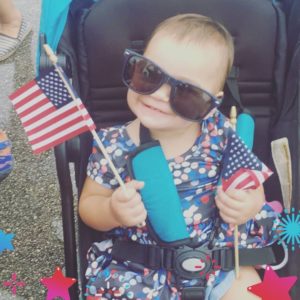 BRAA Fourth of July Photo Booth 2018 youngster with sunglasses and American flag
