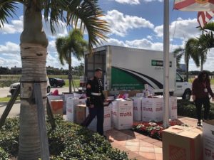 Toys for Tots collections at BRAA offices. Toys outside on a sunny day.