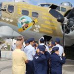 CAP and Juniot ROTC students gather around World War II Flying Fortress, B-17 Nine O Nine at Wings of Freedom Tour