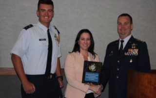 CAP Award with BRAA Airport Executive Director Clara Bennett accepts award from Civil Air Patrol