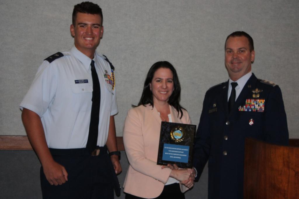 CAP Award with BRAA Airport Executive Director Clara Bennett accepts award from Civil Air Patrol