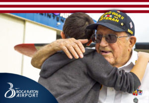 Boy and Veteran hug