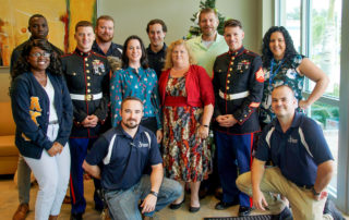 BCT Staff and USMC sergeants pose after loading toys