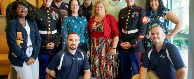 BCT Staff and USMC sergeants pose after loading toys