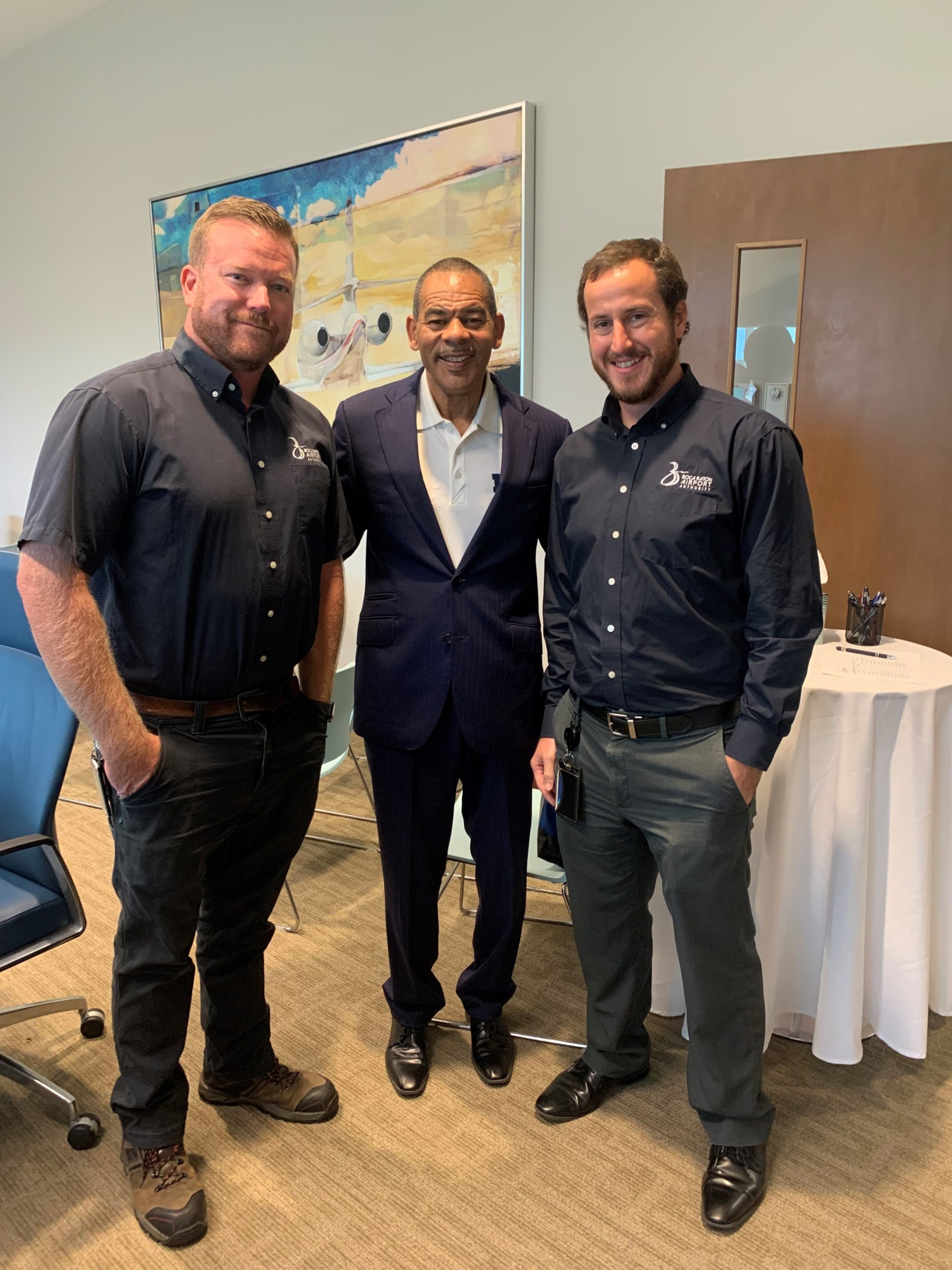 Pictured are Boca Raton Airport Authority Operations Director Travis Bryan, NBC 6 News Anchor Willard Shepard, and Finance and Administration Manager Robert Abbott.